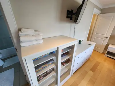 a bathroom with a white dresser with towels on it at Burnaby 4 bed 3 bath duplex in Burnaby