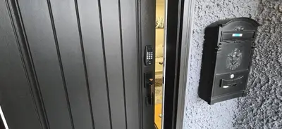 a door with a mailbox next to a wall at Burnaby 4 bed 3 bath duplex in Burnaby