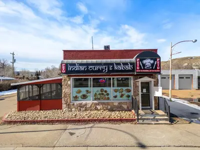 a fast food restaurant sitting on the side of a street at Bluebird 3 Bedroom Home in the Heart of Drumheller in Drumheller
