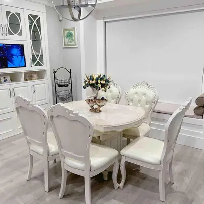 a white dining room with a white table and chairs at Cozy home in Richmond