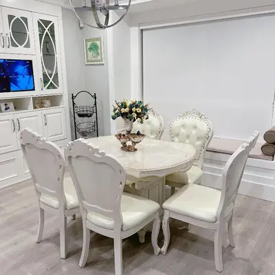 a white dining room with a white table and chairs at Cozy home in Richmond