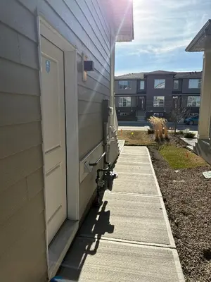a door on the side of a building at Coziest & Modern Basement Retreat East of Calgary in Chestermere
