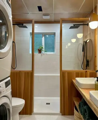 a bathroom with a shower and a toilet and a sink at Tea Time Lakeside in Fauquier
