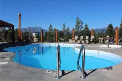 a large swimming pool in a parking lot at Mountain View Retreat in Radium Hot Springs
