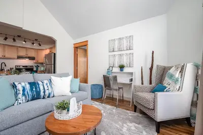 a living room with a couch and a table at Rocky Mountain Oasis-Mountain View! in Canmore