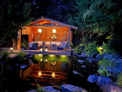 a backyard garden with a tiny house and a pond at Couple's Oasis at Horner Park in Victoria