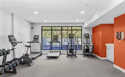 a gym with several exercise bikes and treadmills at Sparrowhawk Mountain Resort in Dead Man's Flats
