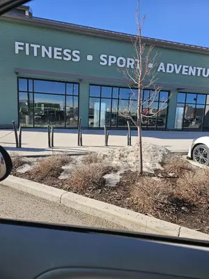 a car parked in front of a fitness store at Brand-New Guesthouse-2bedrooms in Calgary