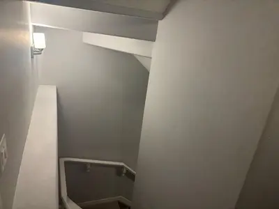 a small bathroom with a toilet in a room at Spacious 2BR Suite - SW Edmonton in Edmonton