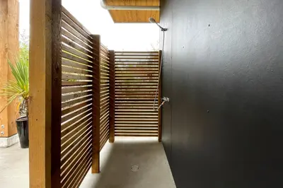a door leading to a hallway with a stair case at Aurelia Guest Suite and Sauna in Tofino