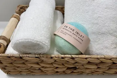 a basket filled with towels and an egg with a note at Aurelia Guest Suite and Sauna in Tofino