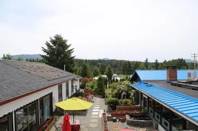 an overhead view of a building with a yellow umbrella at Timberlodge RV & Campground in Port Alberni