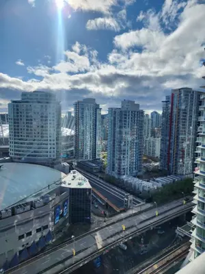 a view of a city with tall buildings at Modern High-Rise 1 Bedroom Condo with water view near stadiums in Vancouver