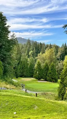a view of a golf course with trees at Birdie on the Hill in Mission City