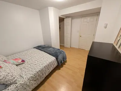 a bedroom with a bed in a room at Walnut Grove Gem in Langley