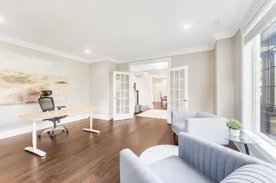 a living room with a desk and chairs at Sunnymede Vacation Stay in Richmond