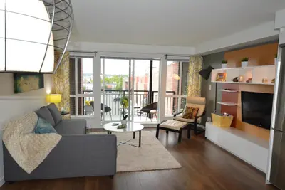 a living room with a couch and a table at Be Close To Chinatown When You Are In The Union Building in Victoria