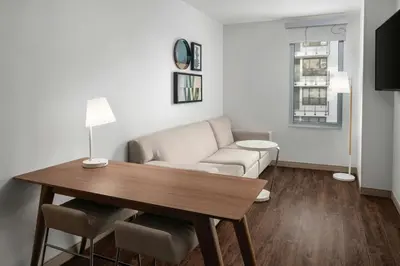 a living room with a table and a couch at Element Calgary Downtown by Westin in Calgary