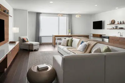 a living room with a couch and a table at Element Calgary Downtown by Westin in Calgary