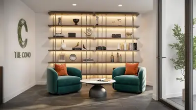 a living room with two chairs and a table at The Como Hotel in Vancouver