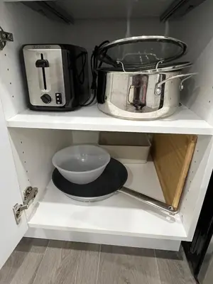 a kitchen shelf with a toaster and a toaster and a bowl at Comfy & Modern 2 Bedroom Guest Suite with King Bed in Edmonton