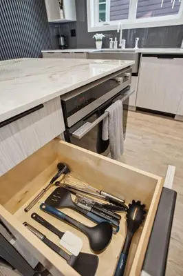 a drawer full of kitchen utensils in a cabinet at Luxury Downtown Vancouver Home Near Sunset Beach with Parking in Vancouver
