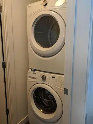 a washing machine and a dryer in a room at Discover Tranquility in this 2 bed townhouse in Vancouver