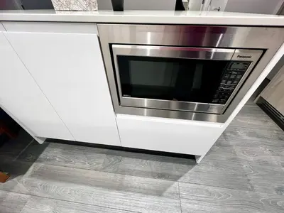 a kitchen with a white counter top with a microwave at Exquisite 1bed 1 bath locates in city center in Richmond