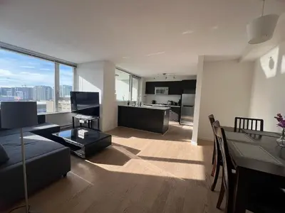 a living room with a couch and a table at Elegant &comfortable room1B &1B apartment perfect location in Richmond