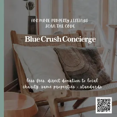 a picture of a couch with a pillow and a table at Surf Haven - Cabin in Ucluelet - Sleeps 5 in Ucluelet