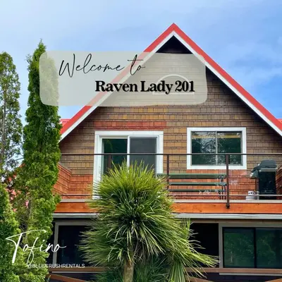 a house with a sign that reads welcome to raven lady at Raven Lady #201- Ucluelet Sleeps 6 Pet Friendly in Ucluelet