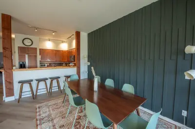 a dining room with a wooden table and chairs at Big Beach Escape - Ucluelet - Sleeps 6 - Pet Friendly in Ucluelet