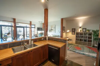 a kitchen with a sink and a counter top at Big Beach Escape - Ucluelet - Sleeps 6 - Pet Friendly in Ucluelet