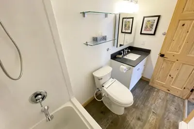 a bathroom with a toilet and a sink and a shower at Raven Lady #202- Ucluelet, Sleeps 4, Pet Friendly in Ucluelet