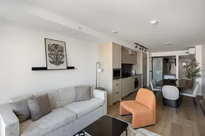 a living room with a couch and a dining room at Keefer House in Vancouver