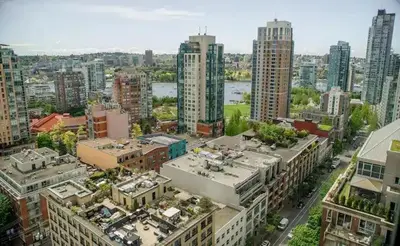 an aerial view of a city with tall buildings at Luxury Ocean view Apartment- Heart of Yaletown Downtown Vancouver in Vancouver