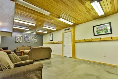 a room with a waiting room with chairs and a door at Dog friendly Home on Ski Hill with Hot Tub by StayIn in Fernie