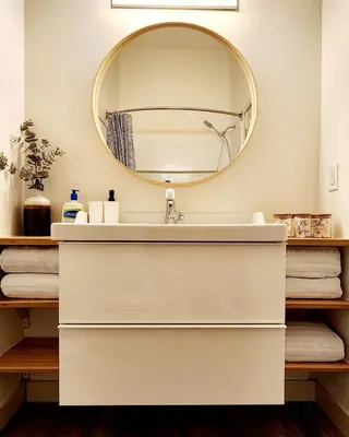 a bathroom with a white sink and a mirror at The OVERLOOK Stay-Mountain View-Free Parking in Canmore