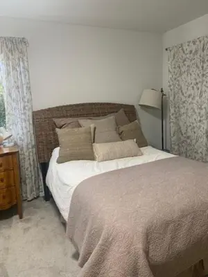 a bedroom with a large bed and a window at West Vancouver 3 bedroom Spacious Very Well Maintained Close to Ocean Mts Hikes Golf Shopping City Whistler in West Vancouver