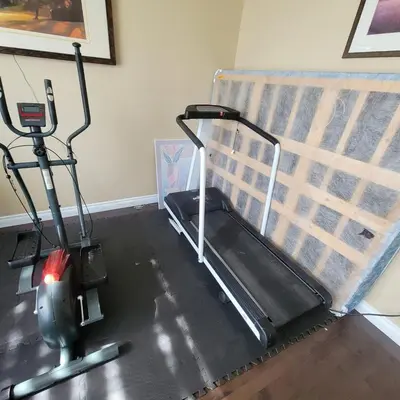 a gym with a treadmill and an exercise bike at Ogden 3-Bed Home in Calgary