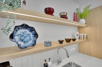 a kitchen with a sink and a plate on a shelf at 3 Bedroom with Heated Outdoor Pool and Hottub! in Canmore