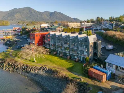 an aerial view of a building next to the water at Tofino Waterfront Condo in Tofino