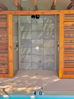 a room with a shower with a glass door at 2BR plus Loft and Sofabed in Tyndall Stone Lodge, Epic Village Location, Mountain Views, Pool and Hot Tub in Whistler