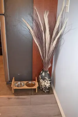 a vase sitting on a shelf next to a table at The Beach House Pool Access 5 Min Walk to Lake Sleeps 8 in Invermere