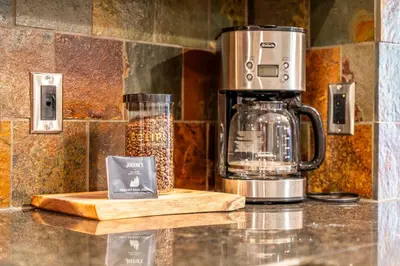 a coffee maker sitting on top of a counter at Stunning 2bd hot tub walking distance to downtown in Canmore