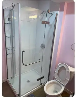 a bathroom with a shower and a toilet at Bedroom in Upland D in Edmonton