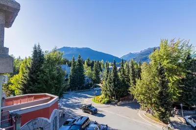 a view of a street with cars parked in a parking lot at Alpenglow Lodge by Elevate Vacations in Whistler