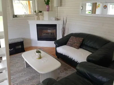 a living room with a couch and a coffee table at Cozy Cabin, 2 min to the HWY1 in Tappen