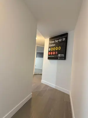 an empty room with a sign on a wall at THE GUEST HOUSE WEST EDMONTON Mall in Edmonton