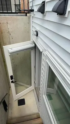 a door with a window on the side of a house at Basement suite -Langley Willoughby in Langley